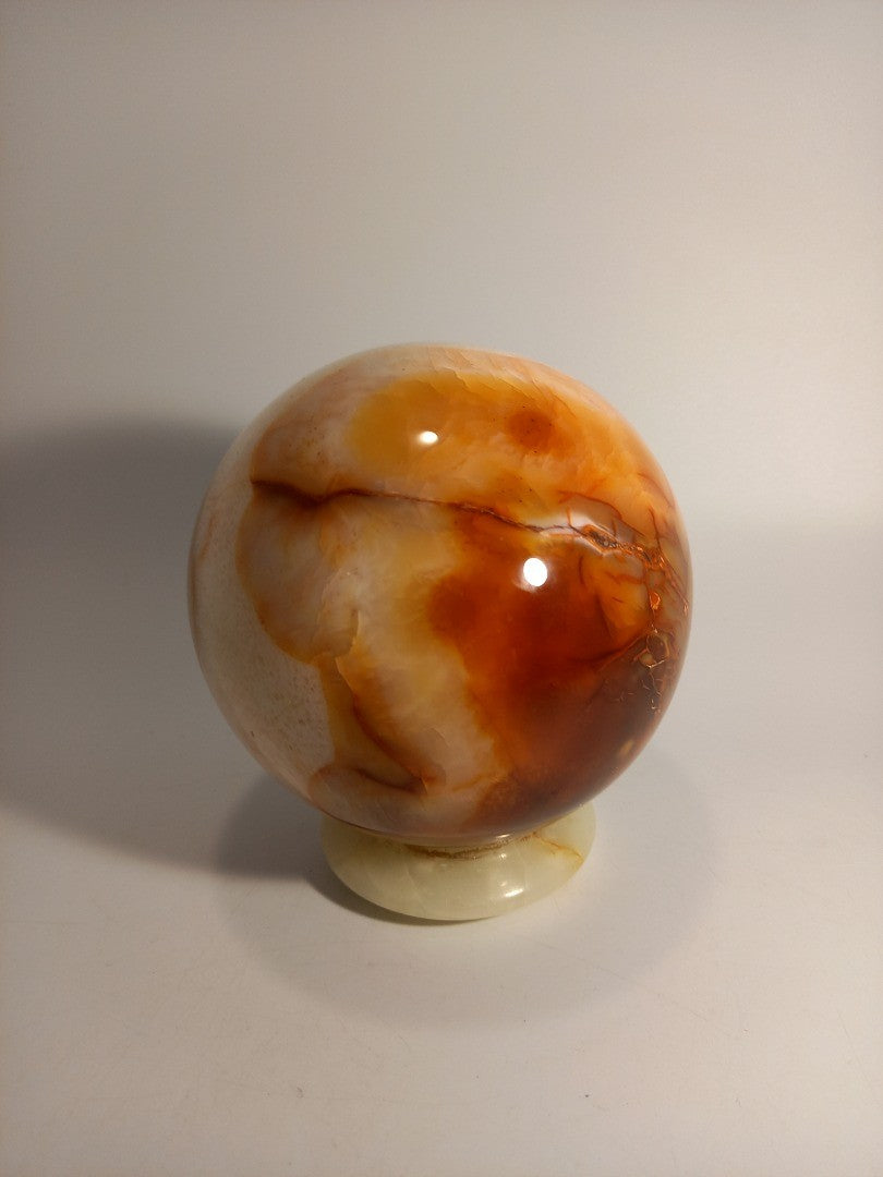 Carnelian Crystal Polished Sphere 5" Decor on Green Onyx Stand